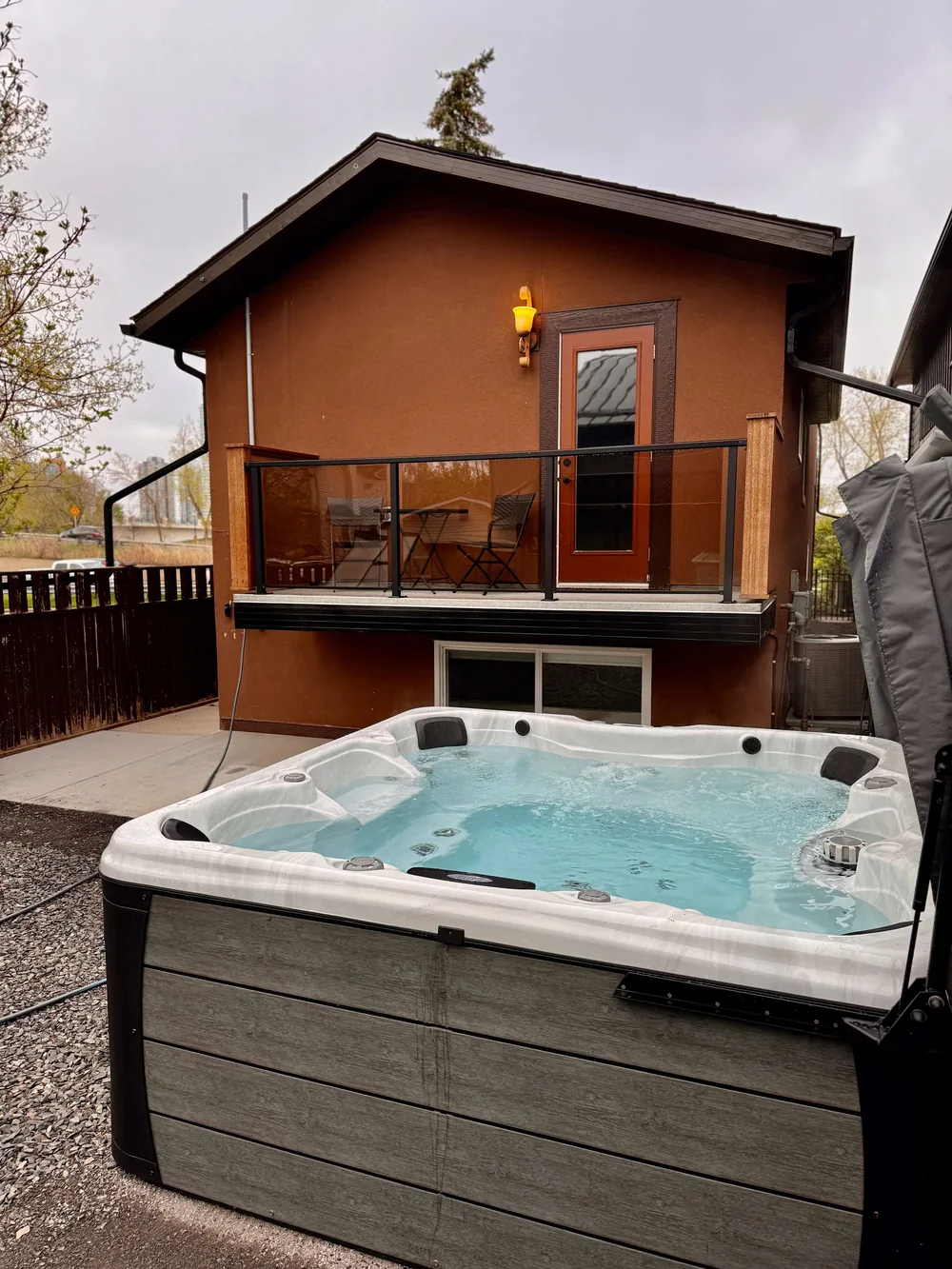 Private hot tub in the fenced outdoor space at The Bruno